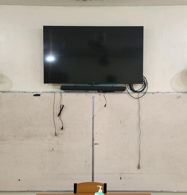 TV and soundbar mounted on the classroom wall